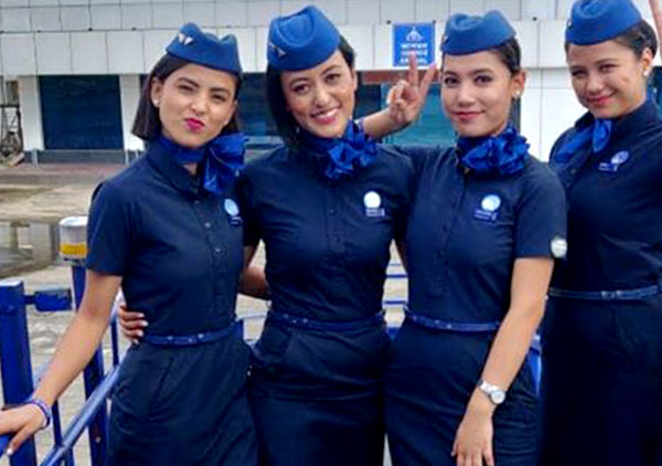 four flight attendent in navy blue dress